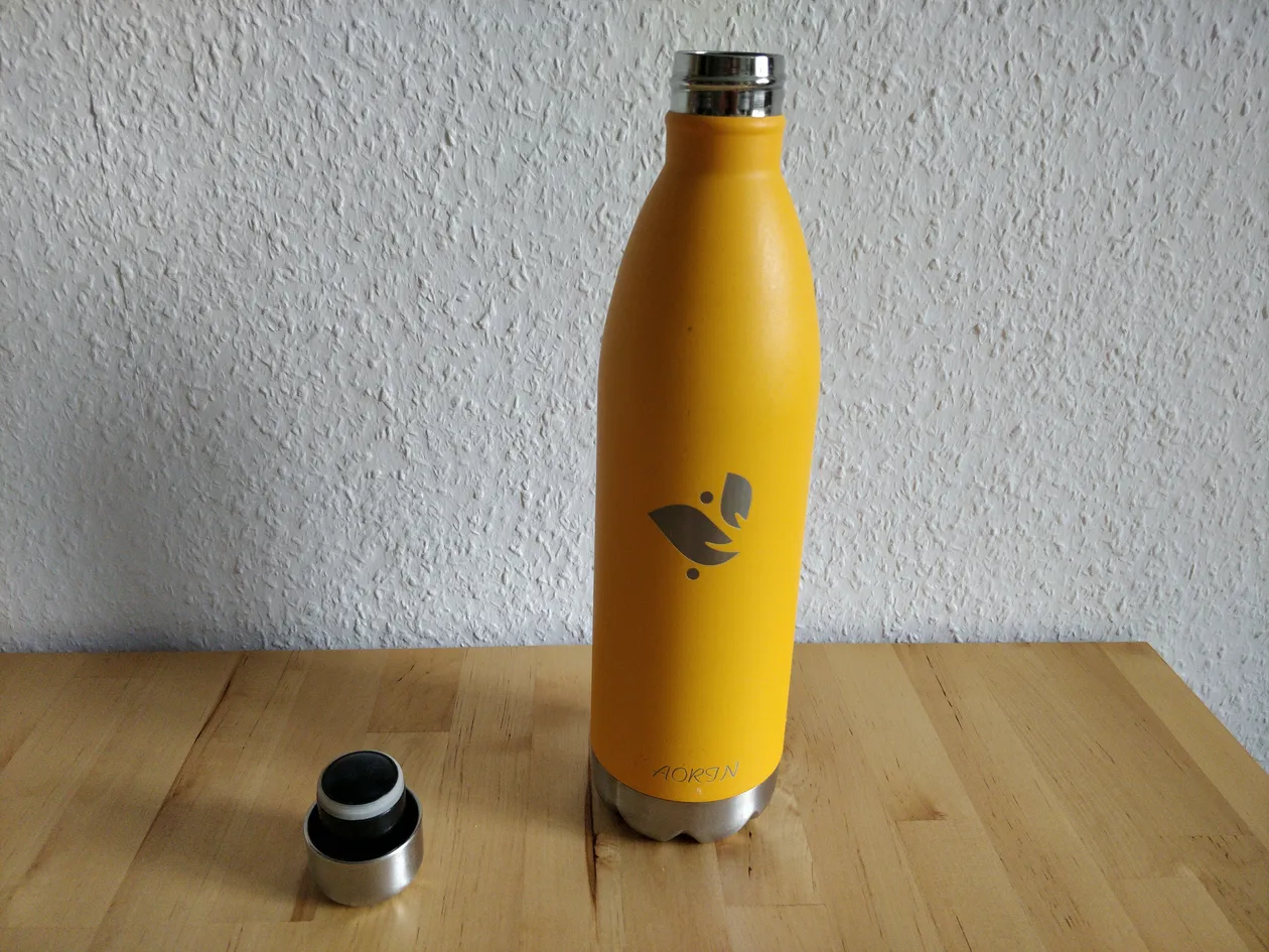 A yellow-orange metal bottle.
